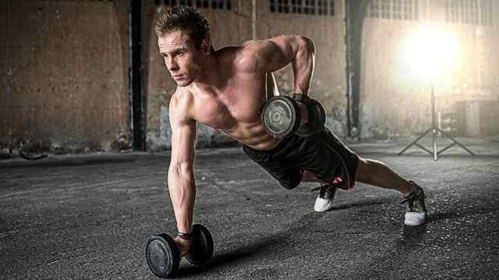 Definitions of Health One handed weighted pressups