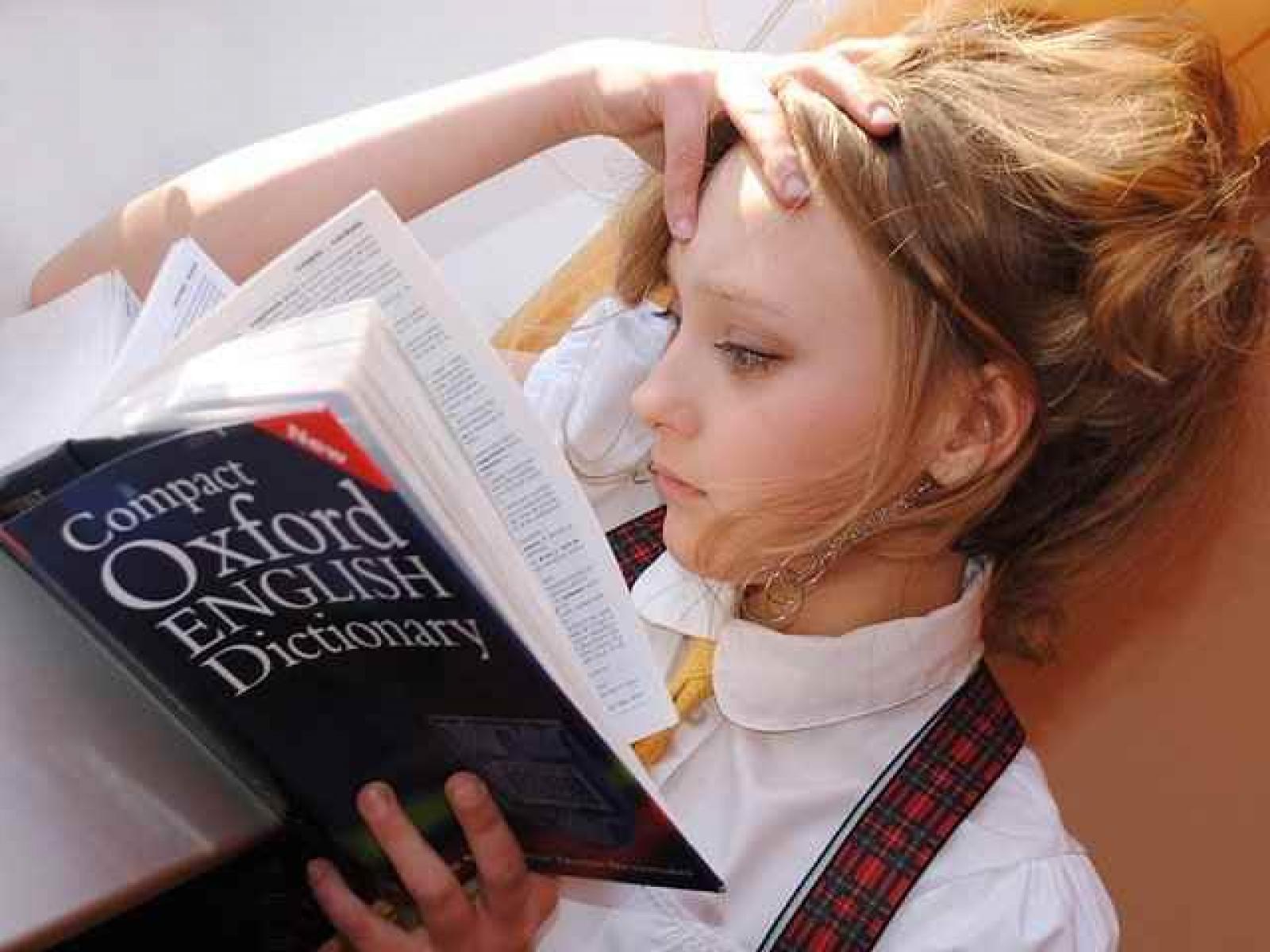 A girl reading an English dictionary